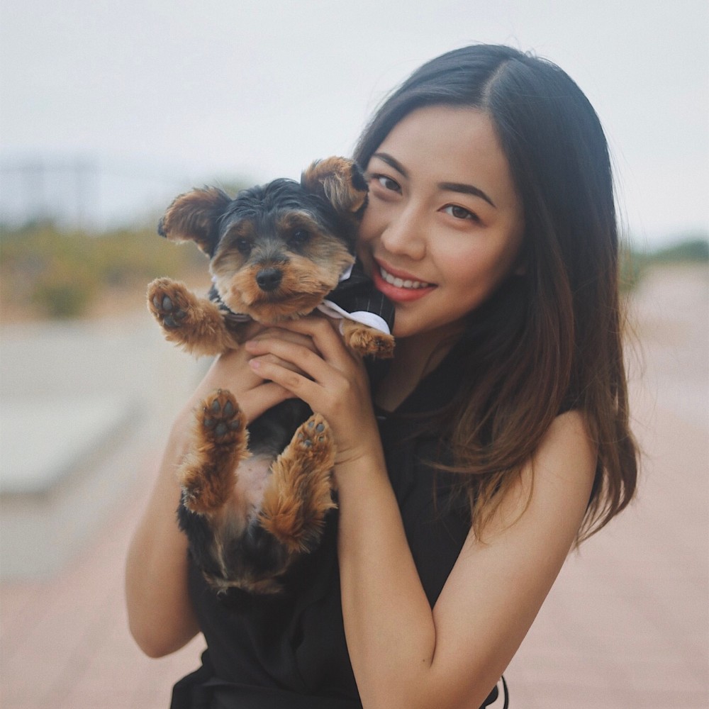 Flora Tong, founder of Appcrush, holding her dog